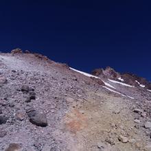 Summit pinnacle comes into view one through the loose gulley