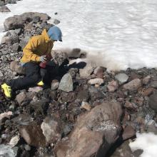 Ranger Clairmont gathering water at the toe on the main snowfield
