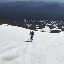 Ascending the Wintun snowfield 11,000 feet. Less sun cups and better surface conditions at this elevation. Our snow approach in background 