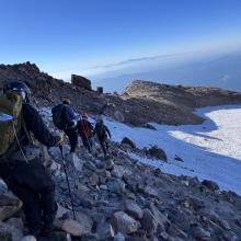 Traverse back across the summit plateau is snow-free. 