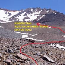 Photo taken 7/18, please stay on the melted out, summer time trail to Lake Helen. The trail is a bit hard to discern across 50/50 due to larger rocks, but can be easily picked up on the east side of the flat. Route highlighted in red.