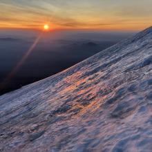 Sun rise over icy spot below the ramp