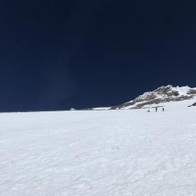 Skiers descending  