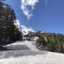 Snow berms across the trail