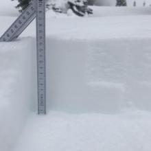 14 cm (9 in) of snow atop crust 