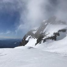 A cloud passes over Green Butte 