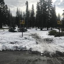 Snowmobile launch ramp. Sledders, stick to the lower half of the parking lot, below the bathrooms please! Do not park in the middle of the road.