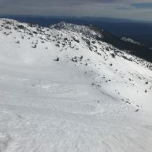 Old wind slab avy debris, looking down into Sun Bowl from Broadway