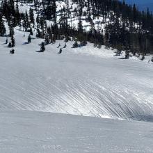 Glassy snow surfaces.