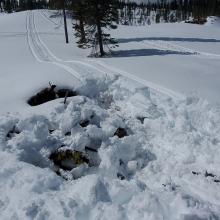 Slash piles are traps for snowmobiles