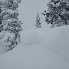 Overhanging cornices breakable upon approach.