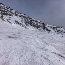 Snow surfaces at Lake Helen are covered in rock and debris.