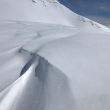 Areas of drifting above treeline, drifts up to 2 feet thick on westerly facing features.
