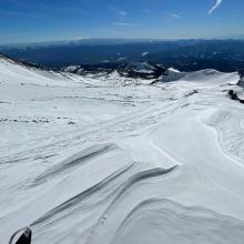 Typical wind textured, chalky, crusty, icy snow surfaces in upper Old Ski Bowl