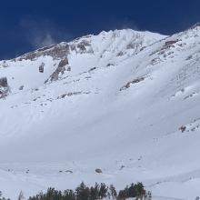 The upper mountain and spindrift blowing around