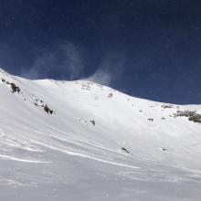 Looking up powder bowl, note: hard wind slabs toward bottom of slope