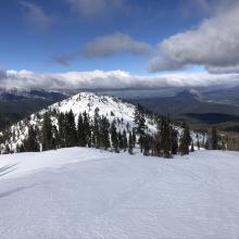 Hard wind pressed snow on ridgeline. A shallow snowpack exists on Right Peak.