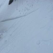 Old avalanche crown line in steep terrain below Middle Peak