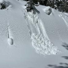 Small, greasy loose-wet slides on sunny slopes below treeline