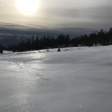 Light, zipper/sun crust near treeline