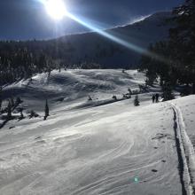 Skinning up the east bowl, notice wind off the ridgeline