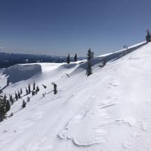 Large overhanging cornices on Middle Peak