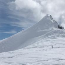 Blowing snow along exposed ridgelines, light snow surface texture