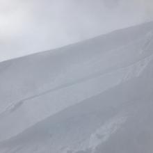 Wind slab, leeward easterly terrain, above treeline, slabs 1 finger hardness, 1 foot thick